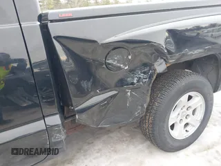 2005 Dodge Dakota SLT with VIN 1D7HE42K75S140168, listed as a IAAI auction lot 41581634 with 121,983 mi miles and . Bid and sale history available at carsss.com. Image 6.