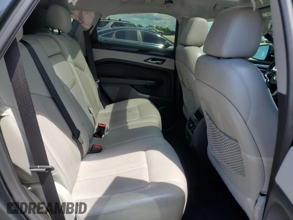2015 Cadillac SRX Luxury Collection z VIN 3GYFNBE31FS598363, wystawiony jako Copart lot #55766975 z przebiegiem 62 103 mil mil oraz Szkody całkowita. Historia ofert i sprzedaży dostępna na DreamBid. Obrazek 11.