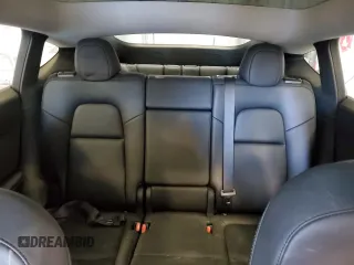 2023 Tesla Model Y Long Range z VIN 7SAYGAEE5PF672546, wystawiony jako Copart lot #42779065 z przebiegiem 27 570 mil mil oraz Nie do naprawy • Non repairable. Historia ofert i sprzedaży dostępna na DreamBid. Obrazek 10.