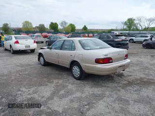 1996 Toyota Camry DX with VIN 4T1BG12K7TU813773, listed as a IAAI auction lot 42084977 with 49,453 mi miles. Bid and sale history available at carsss.com. Image 3.