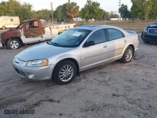 2002 Chrysler Sebring Sdn Touring with VIN 1C3AL56R32N100084, listed as a IAAI auction lot 41941075 with 145,187 mi miles. Bid and sale history available at carsss.com. Image 2.
