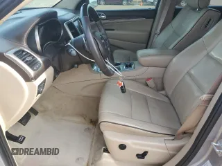 2016 Jeep Grand Cherokee Overland with VIN 1C4RJFCT2GC320247, listed as a Copart auction lot 50832195 with 104,300 mi miles and Salvage title. Bid and sale history available at DreamBid. Image 7.