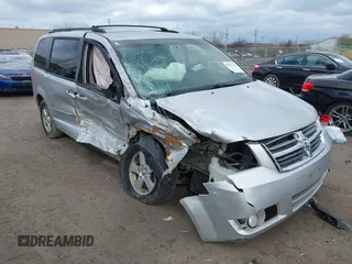 2010 Dodge Grand Caravan SXT with VIN 2D4RN5D13AR180609, listed as a IAAI auction lot 41857215 with Not Provided miles and . Bid and sale history available at DreamBid. Image 1.