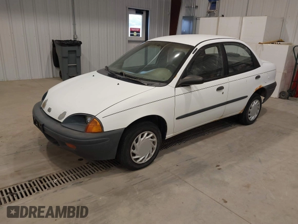 1996 Geo Metro z VIN 2C1MR529XT6777469, wystawiony jako IAAI lot #41392706 z przebiegiem 353 287 mil mil oraz . Historia ofert i sprzedaży dostępna na DreamBid. Obrazek 2.