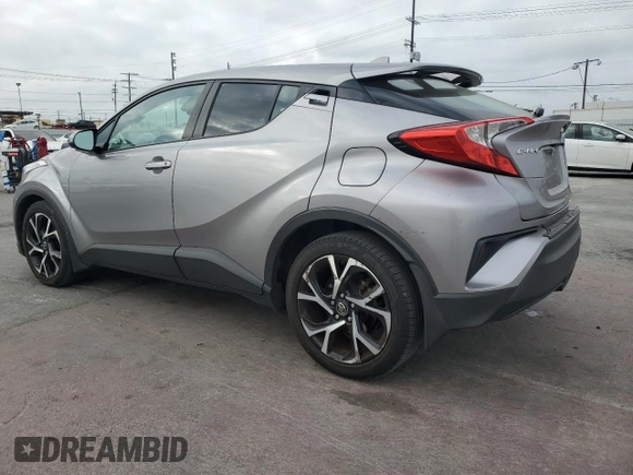 2018 Toyota C-HR XLE z VIN NMTKHMBX3JR023403, wystawiony jako Copart lot #54574245 z przebiegiem 119 657 mil mil oraz Szkoda całkowita • Salvage title. Historia ofert i sprzedaży dostępna na DreamBid. Obrazek 2.