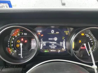 2023 Jeep Wrangler Sahara z VIN 1C4JJXP62PW514489, wystawiony jako Copart lot #51811585 z przebiegiem 39 174 mil mil oraz Szkoda całkowita • Salvage title. Historia ofert i sprzedaży dostępna na DreamBid. Obrazek 9.