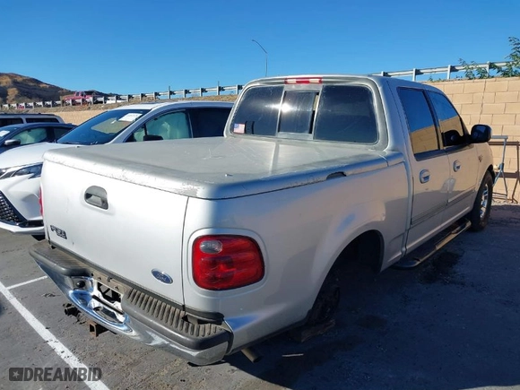 2002 Ford F-150 XLT with VIN 1FTRW07L12KA31478, listed as a IAAI auction lot 41289240 with 277,605 mi miles. Bid and sale history available at carsss.com. Image 4.