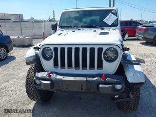 2021 Jeep Wrangler Unlimited Rubicon with VIN 1C4HJXFN9MW519496, listed as a IAAI auction lot 41676845 with 72,767 mi miles. Bid and sale history available at carsss.com. Image 6.