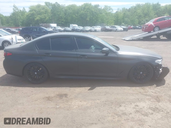 2023 BMW 5 Series M550i xDrive with VIN WBA13BK02PCN47443, listed as a IAAI auction lot 42290388 with Not provided miles and . Bid and sale history available at DreamBid. Image 13.