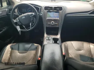 2019 Ford Fusion Titanium with VIN 3FA6P0K91KR217096, listed as a Copart auction lot 57796185 with 84,128 mi miles and Salvage title. Bid and sale history available at DreamBid. Image 8.