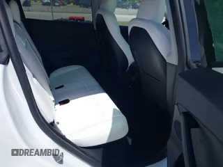 2025 Tesla Model Y Long Range with VIN 7SAYGDED6SF234278, listed as a IAAI auction lot 41781695 with 1,168 mi miles and . Bid and sale history available at DreamBid. Image 8.