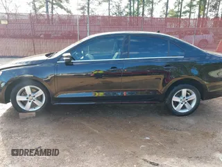 2012 Volkswagen Jetta TDI w/Premium with VIN 3VWLL7AJ2CM426050, listed as a IAAI auction lot 41332817 with 111,996 mi miles and . Bid and sale history available at DreamBid. Image 14.