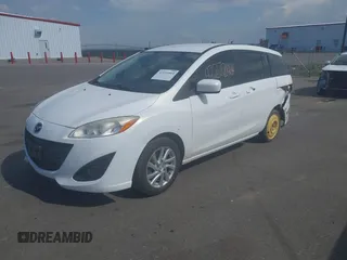 2012 Mazda 5 Sport z VIN JM1CW2BL4C0102615, wystawiony jako IAAI lot #42272464 z przebiegiem 212 961 mil mil oraz . Historia ofert i sprzedaży dostępna na DreamBid. Obrazek 2.