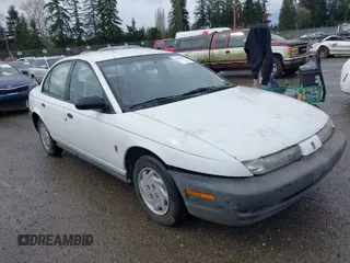 1997 Saturn SL with VIN 1G8ZF5283VZ400170, listed as a IAAI auction lot 41884490 with 171,635 mi miles. Bid and sale history available at carsss.com. Image 1.