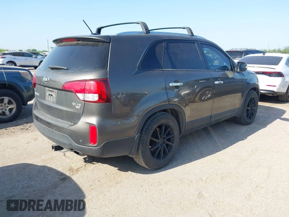 2015 Kia Sorento EX with VIN 5XYKU4A77FG555269, listed as a IAAI auction lot 42014317 with 168,218 mi miles and . Bid and sale history available at carsss.com. Image 4.