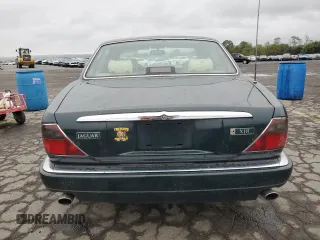 1996 Jaguar XJ with VIN SAJHX1741TC758740, listed as a Copart auction lot 73377914 with 140,964 mi miles and Salvage title. Bid and sale history available at DreamBid. Image 6.