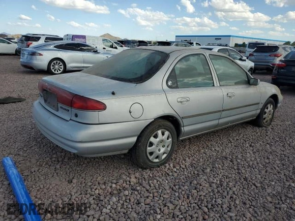 1998 Mercury Mystique GS с VIN 1MEFM6530WK662855, выставлен на аукционе Copart как лот 62407575 с пробегом 135 987 миль миль и Чистый • Clean title. История ставок и продаж доступна на DreamBid. Изображение 3.