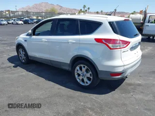 2013 Ford Escape SEL with VIN 1FMCU0HX1DUB99590, listed as a IAAI auction lot 41987910 with 129,954 mi miles. Bid and sale history available at carsss.com. Image 3.