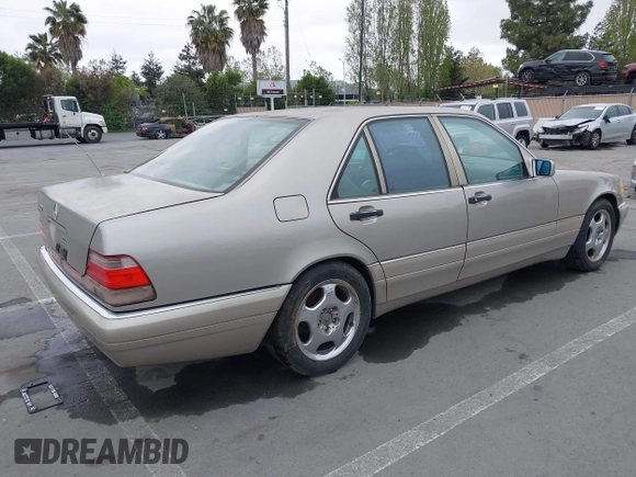 1997 Mercedes-Benz S-Class with VIN WDBGA32G1VA349367, listed as a IAAI auction lot 42079132 with 383,250 mi miles. Bid and sale history available at carsss.com. Image 4.