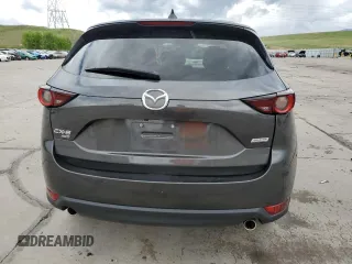 2018 Mazda CX-5 Touring z VIN JM3KFBCM4J0349687, wystawiony jako Copart lot #55857945 z przebiegiem Nie podano mil oraz Szkoda całkowita • Salvage title. Historia ofert i sprzedaży dostępna na DreamBid. Obrazek 6.
