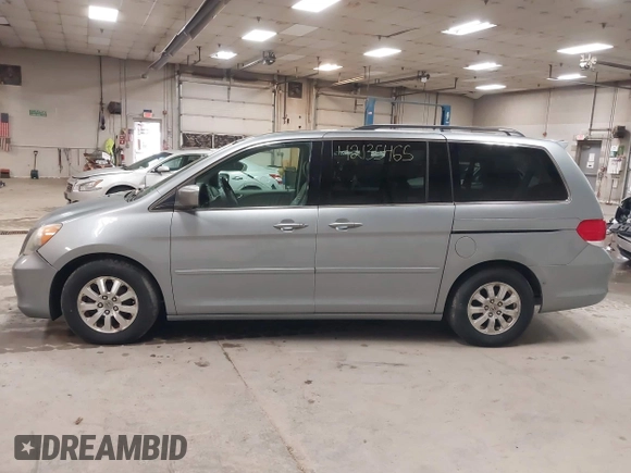 2009 Honda Odyssey EX-L with VIN 5FNRL38789B015524, listed as a IAAI auction lot 42135465 with 242,005 mi miles. Bid and sale history available at carsss.com. Image 12.