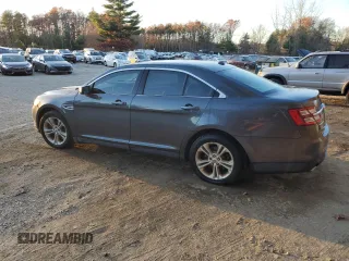 2015 Ford Taurus SE with VIN 1FAHP2D86FG184747, listed as a Copart auction lot 77659254 with 140,404 mi miles and Clean Title. Bid and sale history available at carsss.com. Image 2.