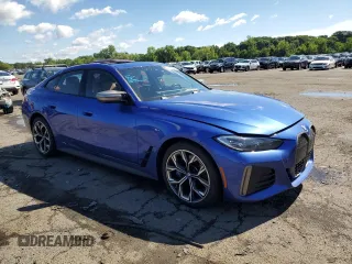 2022 BMW i4 M50 with VIN WBY33AW04NFM42431, listed as a Copart auction lot 60519024 with 53,447 mi miles and Salvage Title. Bid and sale history available at carsss.com. Image 4.