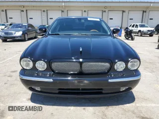 2004 Jaguar XJ с VIN SAJEA73B34TG10749, выставлен на аукционе Copart как лот 56574025 с пробегом 72 240 миль миль и Списание • Salvage title. История ставок и продаж доступна на DreamBid. Изображение 5.