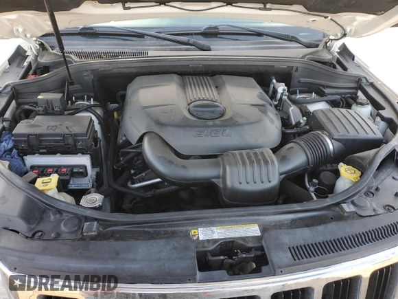 2011 Jeep Grand Cherokee Laredo with VIN 1J4RR4GG4BC640277, listed as a Copart auction lot 52166205 with 195,877 mi miles and Salvage Title. Bid and sale history available at DreamBid. Image 12.