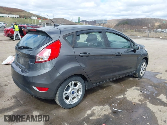 2015 Ford Fiesta SE with VIN 3FADP4EJ0FM117739, listed as a IAAI auction lot 41795558 with 111,000 mi miles. Bid and sale history available at carsss.com. Image 4.