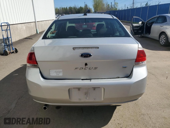 2009 Ford Focus SE z VIN 1FAHP35N29W126266, wystawiony jako Copart lot #56886465 z przebiegiem 420 672 mil mil oraz Czysty tytuł • Clean title. Historia ofert i sprzedaży dostępna na DreamBid. Obrazek 6.
