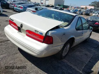 1996 Ford Thunderbird LX with VIN 1FALP62W8TH128351, listed as a IAAI auction lot 41730676 with 166,550 mi miles. Bid and sale history available at carsss.com. Image 4.
