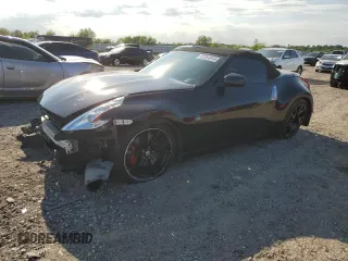 2014 Nissan 370Z Touring with VIN JN1AZ4FH3EM621279, listed as a Copart auction lot 52284814 with 60,479 mi miles and Salvage Title. Bid and sale history available at DreamBid. Image 1.