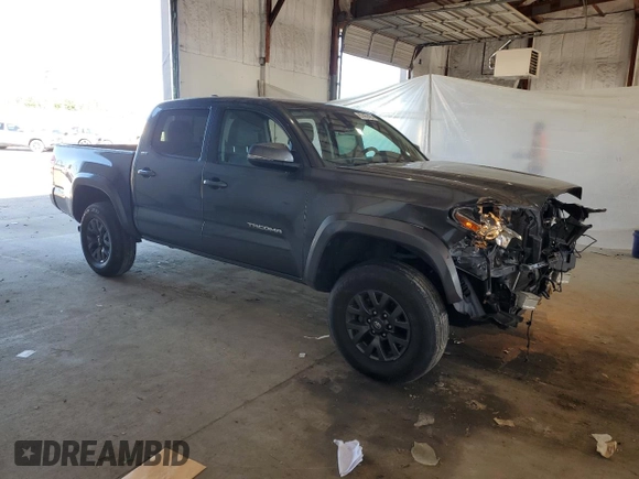 2023 Toyota Tacoma SR z VIN 3TMCZ5AN4PM599664, wystawiony jako Copart lot #57462455 z przebiegiem 65 736 mil mil oraz Szkoda całkowita • Salvage title. Historia ofert i sprzedaży dostępna na DreamBid. Obrazek 4.