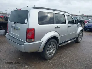 2008 Dodge Nitro SLT with VIN 1D8GT58K58W127412, listed as a IAAI auction lot 41544874 with 232,748 mi miles. Bid and sale history available at carsss.com. Image 4.