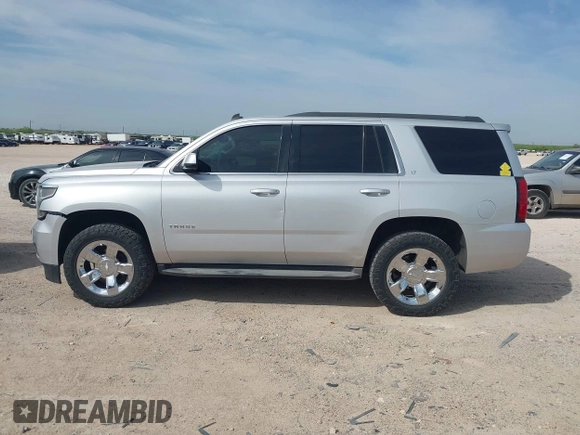 2015 Chevrolet Tahoe LT with VIN 1GNSCBKC9FR111984, listed as a IAAI auction lot 42003685 with 186,391 mi miles and . Bid and sale history available at DreamBid. Image 14.