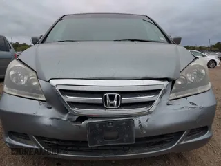 2005 Honda Odyssey EX-L with VIN 5FNRL38625B041067, listed as a IAAI auction lot 40519464 with 117,606 mi miles and . Bid and sale history available at carsss.com. Image 6.