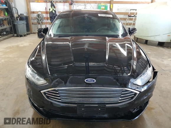 2018 Ford Fusion SE z VIN 3FA6P0H77JR277923, wystawiony jako Copart lot #56897455 z przebiegiem 154 432 mil mil oraz Czysty tytuł • Clean title. Historia ofert i sprzedaży dostępna na DreamBid. Obrazek 5.