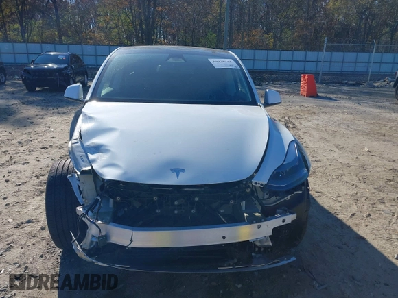 2023 Tesla Model Y Long Range with VIN 7SAYGAEE1PF828338, listed as a IAAI auction lot 40978725 with Not Provided miles and . Bid and sale history available at DreamBid. Image 13.