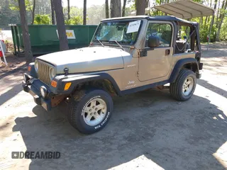 2003 Jeep Wrangler Sport with VIN 1J4FA49S13P313180, listed as a IAAI auction lot 42349673 with 141,073 mi miles and . Bid and sale history available at DreamBid. Image 17.