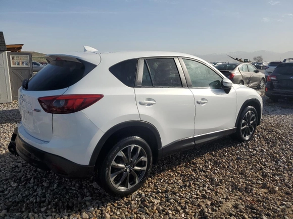 2016 Mazda CX-5 Grand Touring with VIN JM3KE4DY3G0688286, listed as a Copart auction lot 52182205 with 194,352 mi miles and Salvage Title. Bid and sale history available at DreamBid. Image 3.