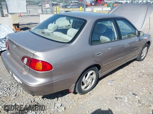 1998 Toyota Corolla VE z VIN 2T1BR18E2WC019524, wystawiony jako IAAI lot #41997009 z przebiegiem 255 968 mil mil oraz . Historia ofert i sprzedaży dostępna na DreamBid. Obrazek 4.
