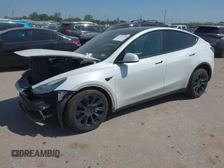 2021 Tesla Model Y Long Range with VIN 5YJYGDEE0MF265339, listed as a IAAI auction lot 41975058 with 51,292 mi miles and . Bid and sale history available at DreamBid. Image 2.