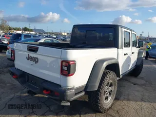 2023 Jeep Gladiator Rubicon z VIN 1C6JJTBG5PL566958, wystawiony jako IAAI lot #42298811 z przebiegiem 18 568 mil mil oraz . Historia ofert i sprzedaży dostępna na DreamBid. Obrazek 4.