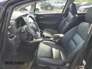 2015 Honda Fit EX-L z VIN 3HGGK5H88FM705989, wystawiony jako Copart lot #57143835 z przebiegiem 132 747 mil mil oraz Szkoda całkowita • Salvage title. Historia ofert i sprzedaży dostępna na DreamBid. Obrazek 7.