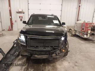 2017 Chevrolet Tahoe LT z VIN 1GNSKBKC6HR310870, wystawiony jako IAAI lot #41975056 z przebiegiem 124 418 mil mil oraz . Historia ofert i sprzedaży dostępna na DreamBid. Obrazek 12.
