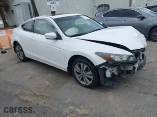 2009 Honda Accord Cpe EX-L with VIN 1HGCS12849A000477, listed as a IAAI auction lot 41783364 with 146,813 mi miles. Bid and sale history available at carsss.com. Image 1.