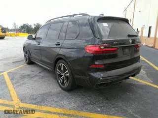 2021 BMW X7 M50i with VIN 5UXCX6C06M9H34992, listed as a IAAI auction lot 41513197 with 22,029 mi miles. Bid and sale history available at carsss.com. Image 3.