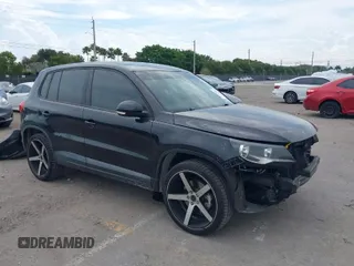 2014 Volkswagen Tiguan SE z VIN WVGAV3AXXEW535128, wystawiony jako IAAI lot #41882213 z przebiegiem 103 161 mil mil oraz . Historia ofert i sprzedaży dostępna na DreamBid. Obrazek 1.