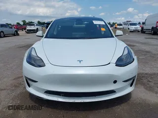 2023 Tesla Model 3 with VIN 5YJ3E1EA5PF407054, listed as a IAAI auction lot 42313770 with 57,621 mi miles and . Bid and sale history available at DreamBid. Image 12.